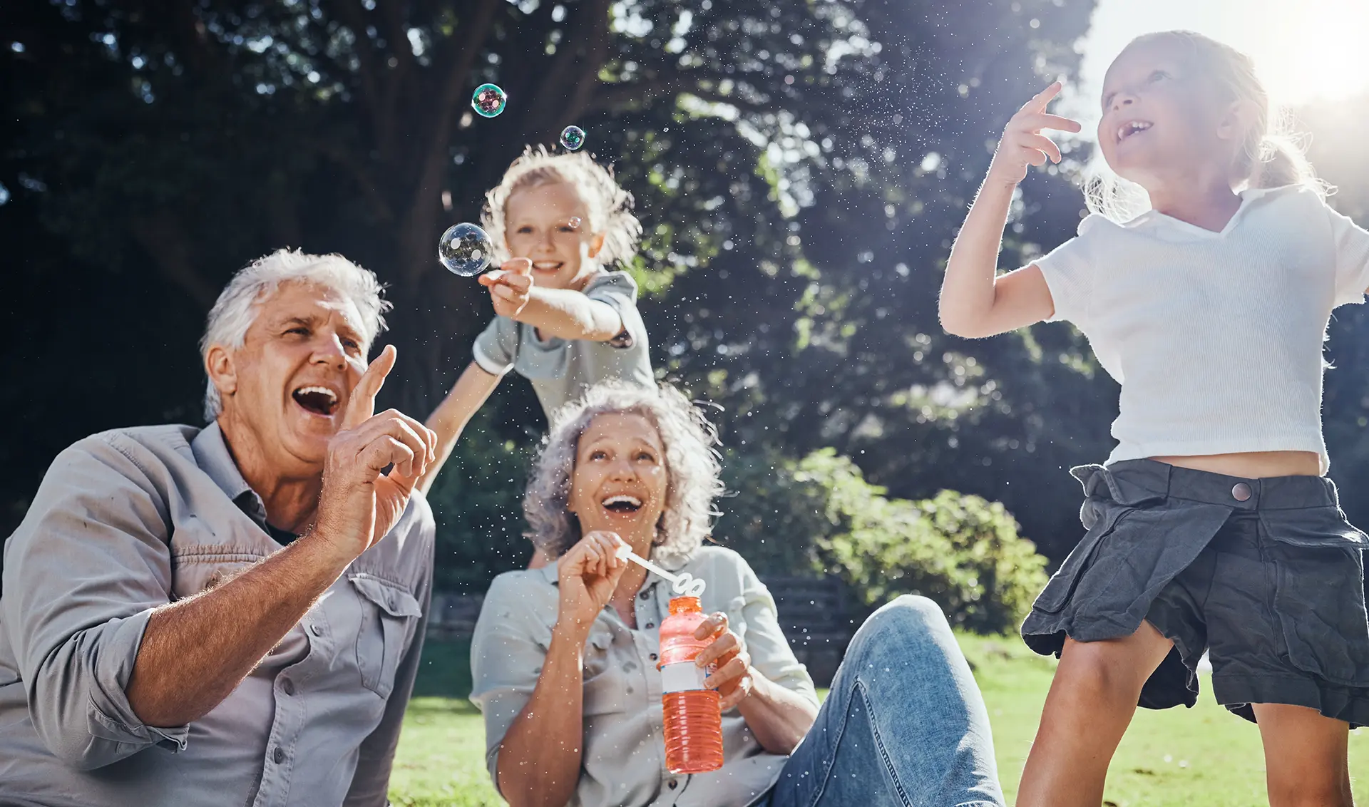 Grandparents playing outside with grandchildren