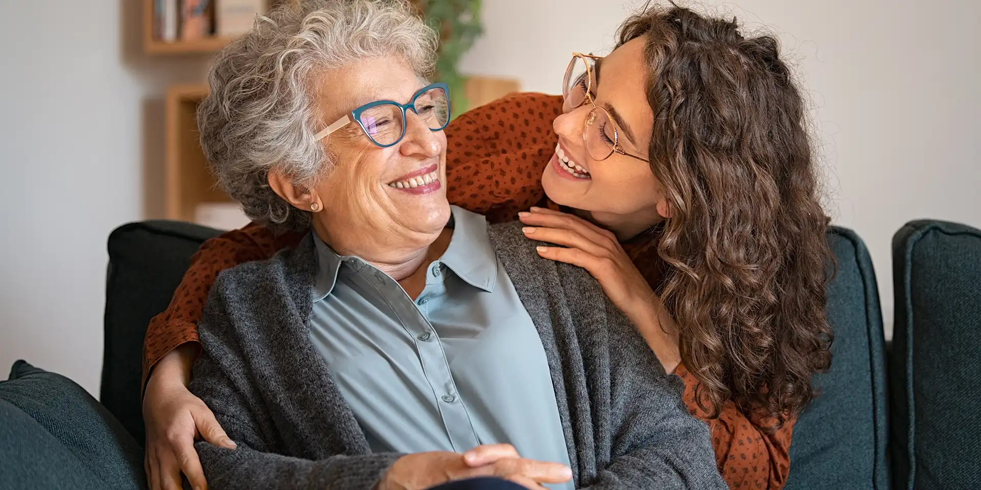 Family members embracing on the couch