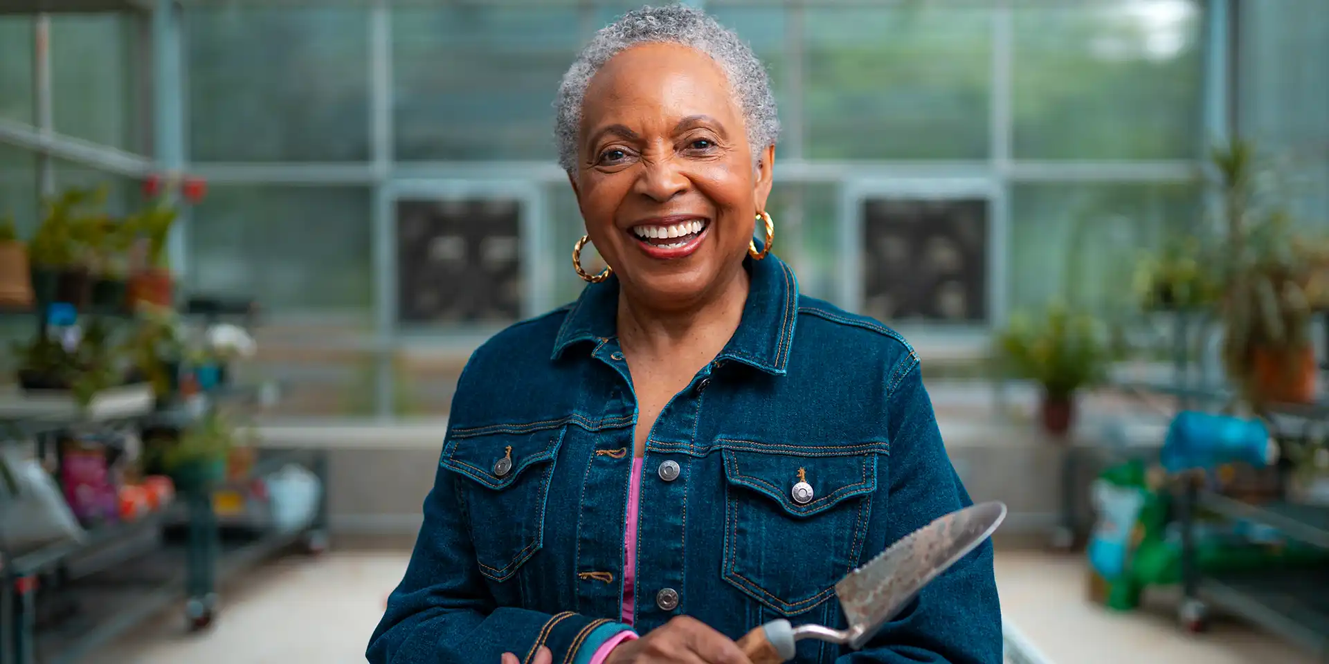 Canterbury resident enjoying time in the Legacy Garden greenhouse