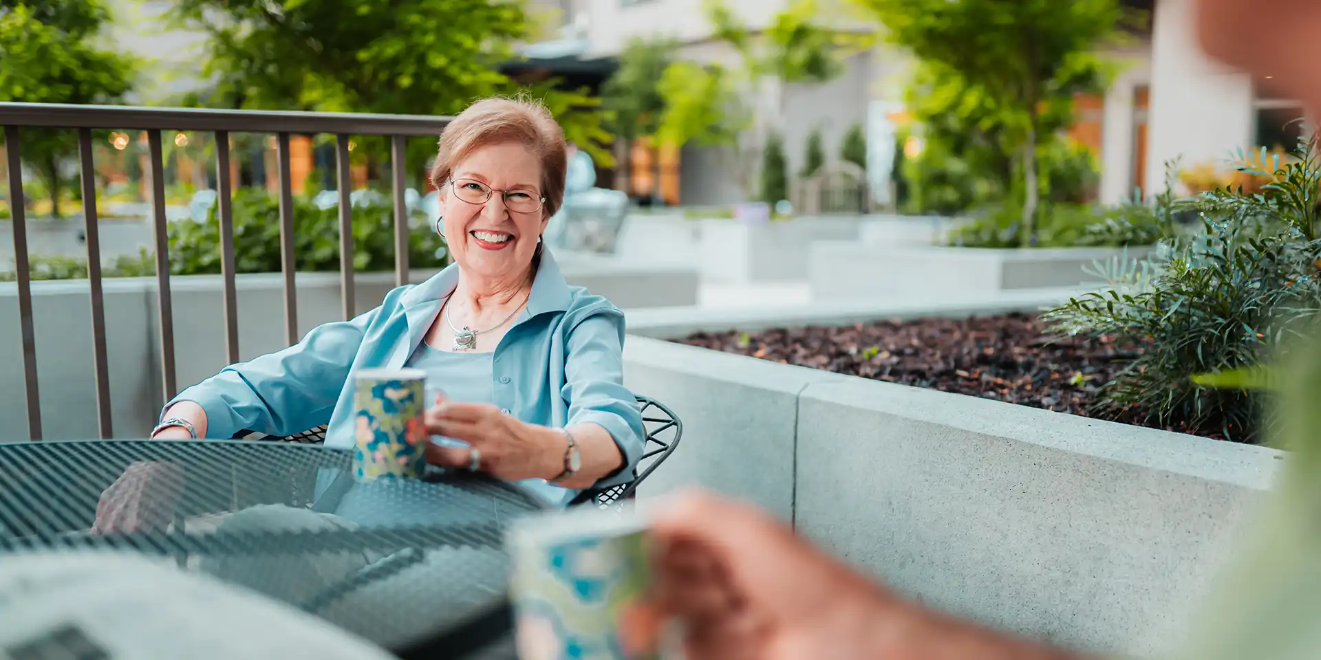 Canterbury Court residents enjoying a cup of morning coffee on the activities deck