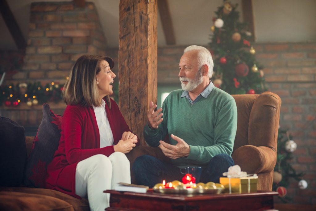 Senior couple planning out retirement during the holidays.
