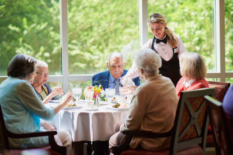 Seniors dining together at Canterbury Court retirement community